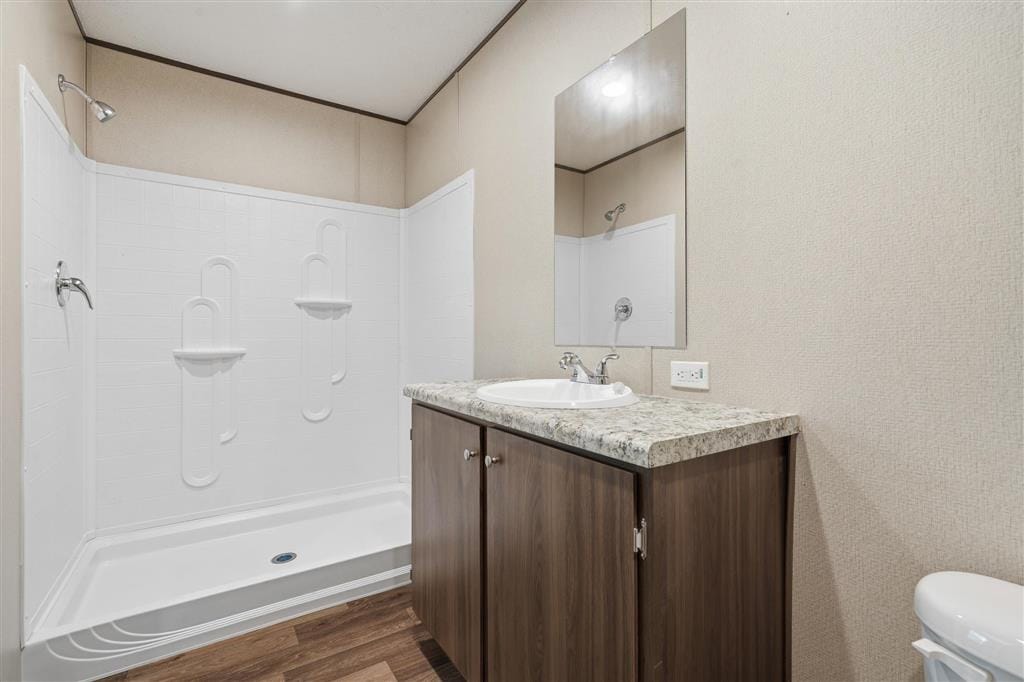 Bathroom with walk-in shower and vanity