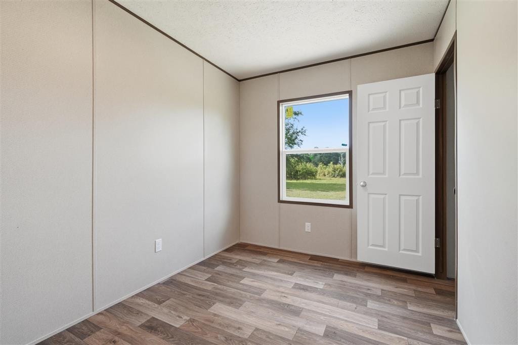 Bedroom with window overlooking the green lawn