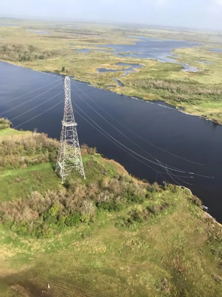 Transmission tower and downed power lines near Lake Charles, Louisiana, following Hurricane Laura.