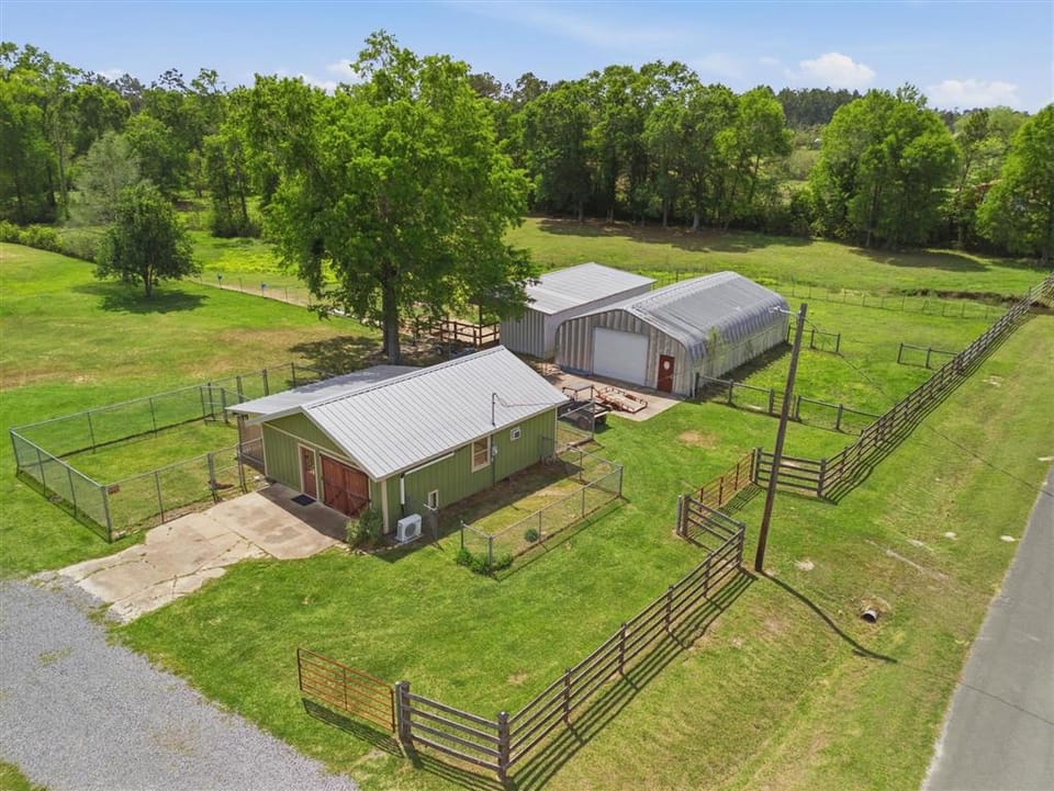 Nearly 12-Acre Longville Mini Farm With Pond, Workshops and Stable Listed at $449,500